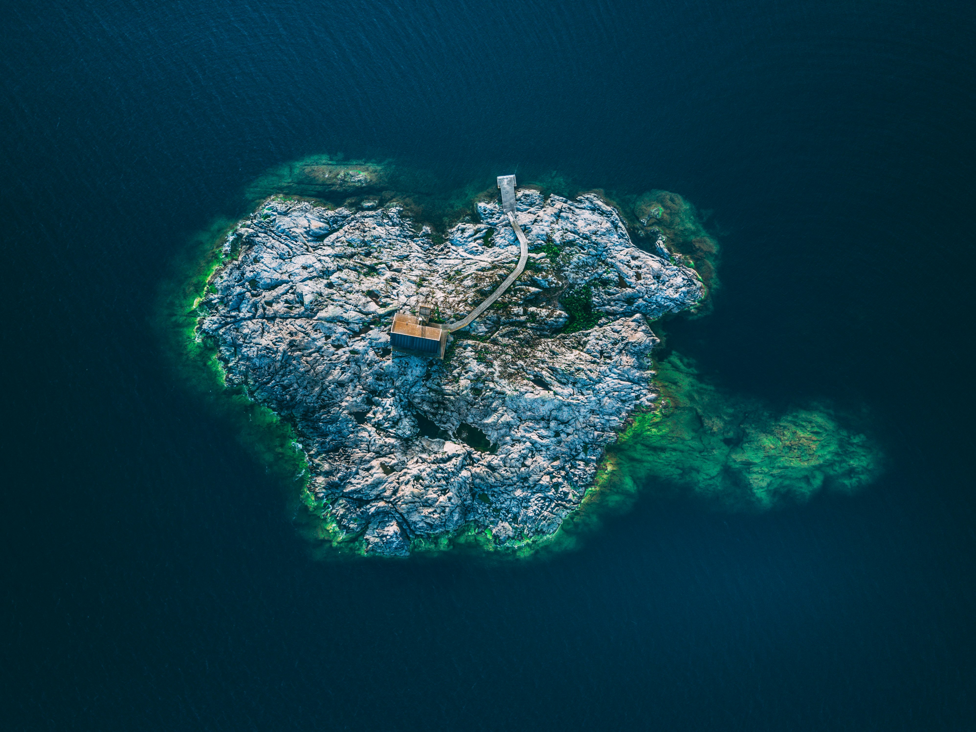 aerial view photography of island surrounded by ocean during daytime